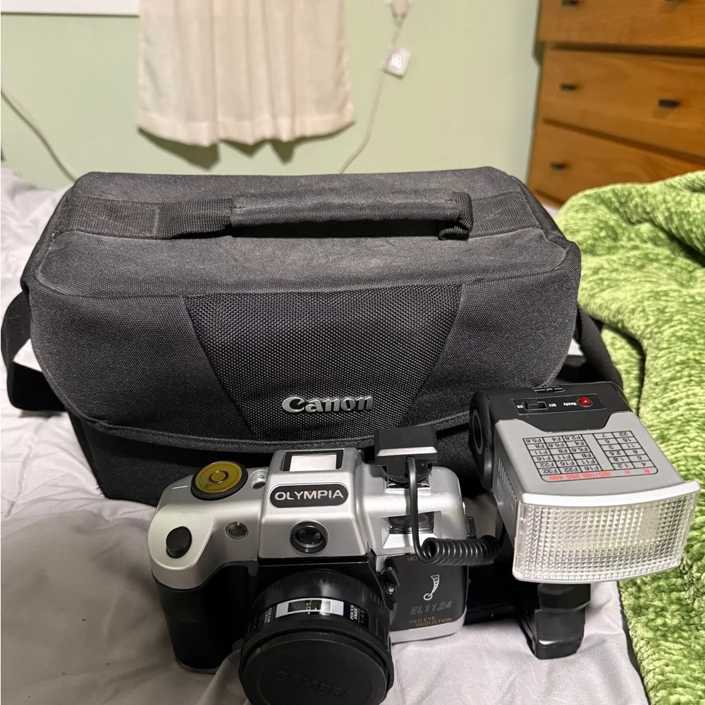 Canon Black Camera Bag with Silver Olympus Film Camera and External Flash